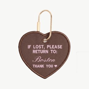 Heart-shaped keychain with text 'If lost, please return to: Boston' on a white background