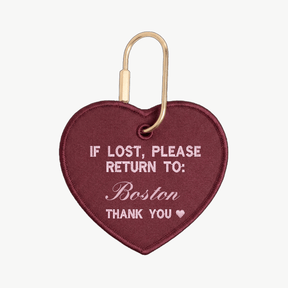 Heart-shaped keychain with text 'If lost, please return to: Boston' on a white background