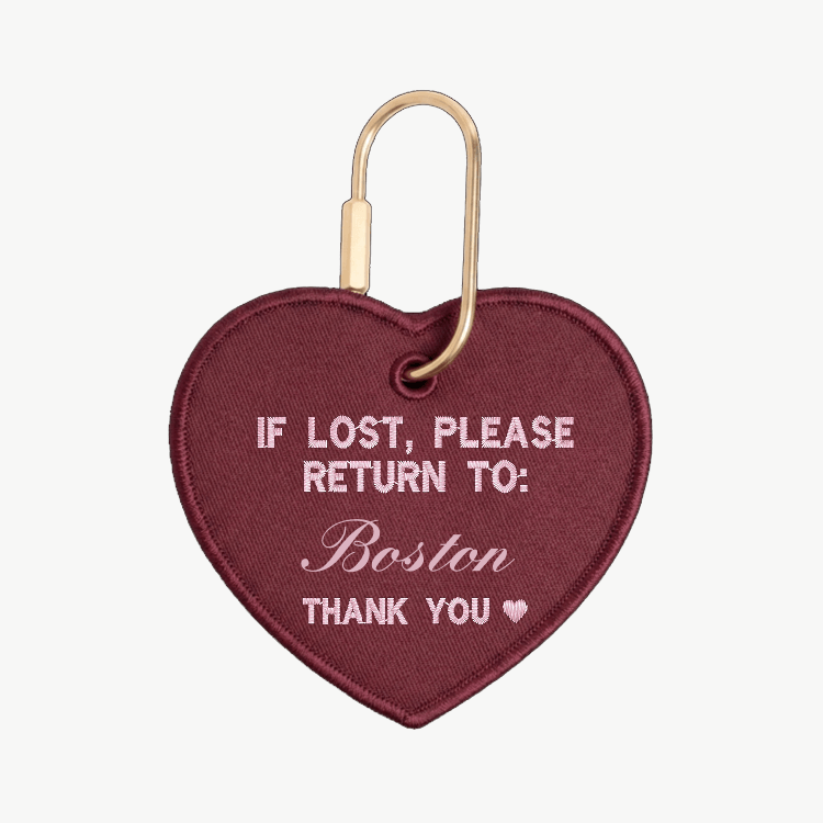 Heart-shaped keychain with text 'If lost, please return to: Boston' on a white background