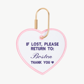 Heart-shaped keychain with text 'If lost, please return to: Boston' on a white background