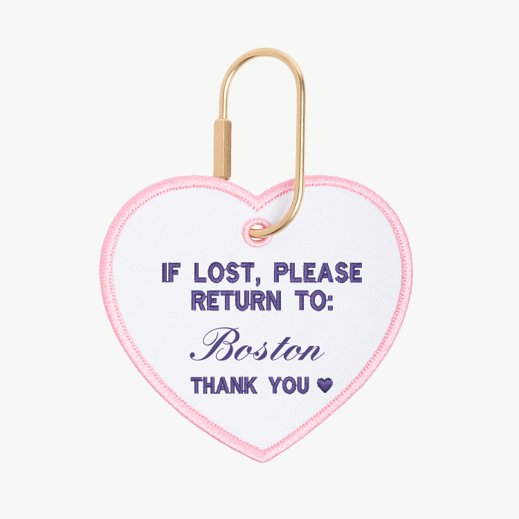 Heart-shaped keychain with text 'If lost, please return to: Boston' on a white background