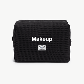 Black bag with 'Makeup' text on a white background