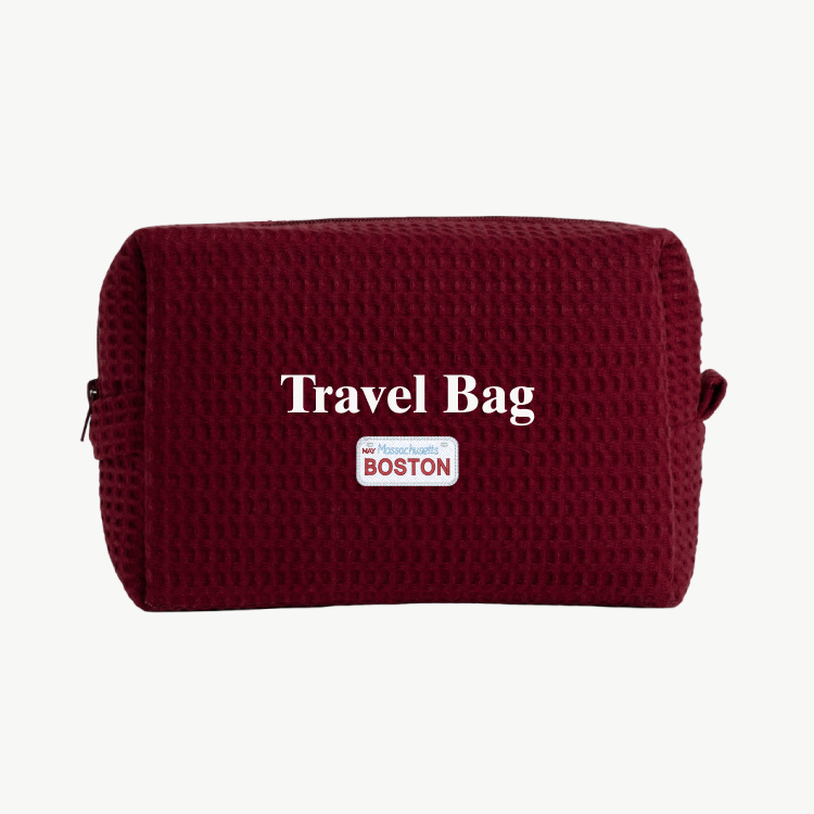 Maroon travel bag with 'Travel Bag' text and 'Boston' label on a white background