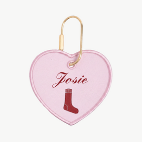 Heart-shaped pink tag with 'Josie' and a sock icon on a white background