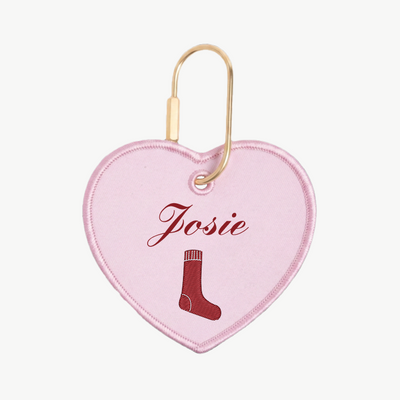 Heart-shaped pink tag with 'Josie' and a sock icon on a white background