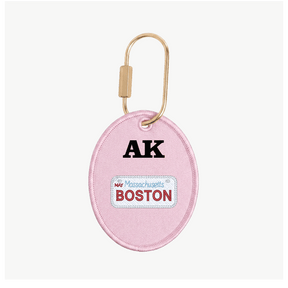 Pink keychain with 'AK' and 'Boston' text on a white background
