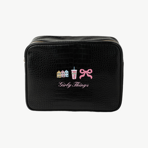 Black toiletry bag with decorative icons and text on a white background