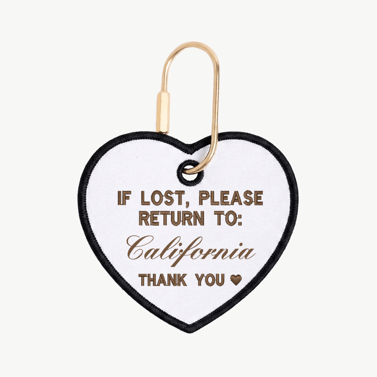 Heart-shaped tag with text 'If lost, please return to: California' on a white background