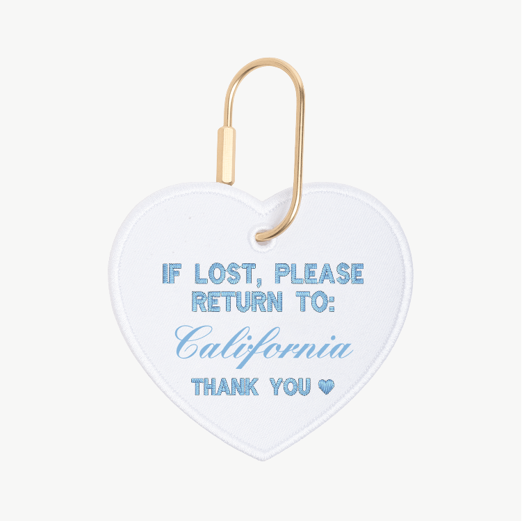 Heart-shaped tag with 'If lost, please return to: California' text on a white background