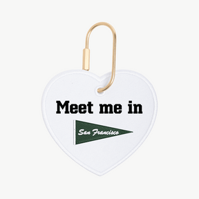 Heart-shaped keychain with 'Meet me in San Francisco' text and flag design on a white background