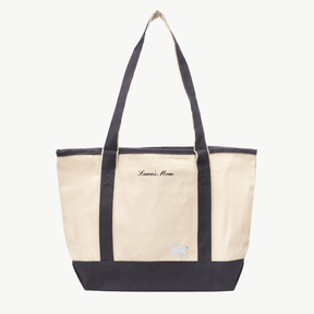 A beige canvas tote bag with long gray handles and a matching gray  base the text 'Luna's Mom' near the top, and a small embroidered silhouette of a cat at the bottom right.