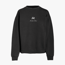 Black crewneck sweatshirt featuring a small embroidered gray cat above the words Mochi's Mom in white script on the chest. The sweatshirt has long sleeves and a simple, relaxed design.