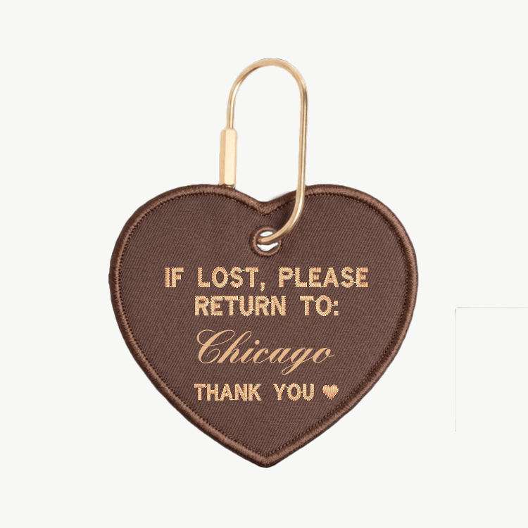 Heart-shaped keychain with text 'If lost, please return to: California' on a white background