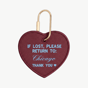 Heart-shaped keychain with text 'If lost, please return to: Chicago' on a white background