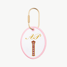 Keychain with 'AP' and 'Chicago' text on a white background