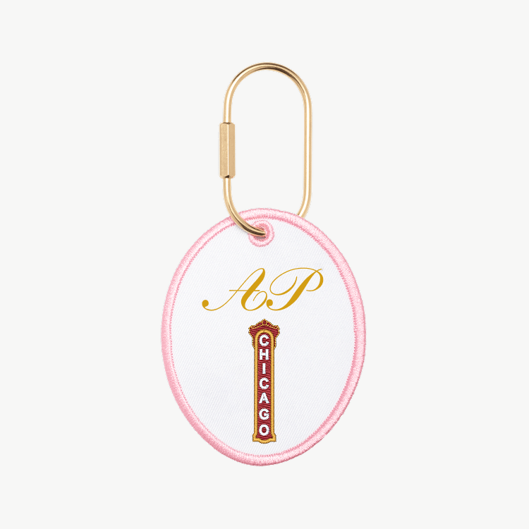 Keychain with 'AP' and 'Chicago' text on a white background