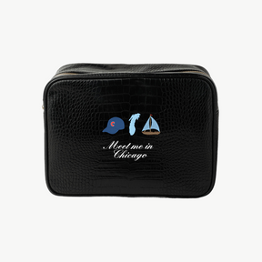 Black toiletry bag with 'Meet me in Chicago' design on a white background