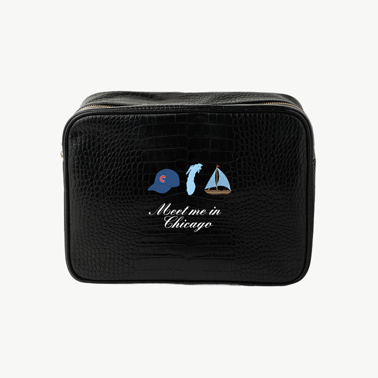 Black toiletry bag with 'Meet me in Chicago' design on a white background