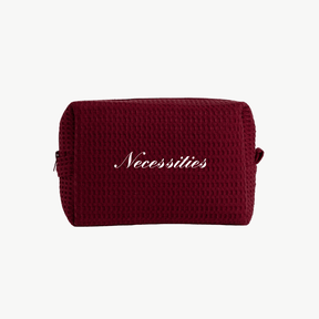 maroon waffle pouch with embroidered text