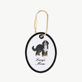 Keychain with Bernese Mountain dog illustration and 'Lucy's Mom' text on a white background