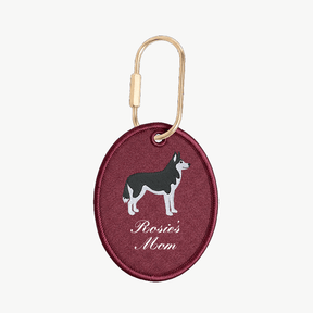 Maroon keychain with dog illustration and 'Rosie's Mom' text on a white background