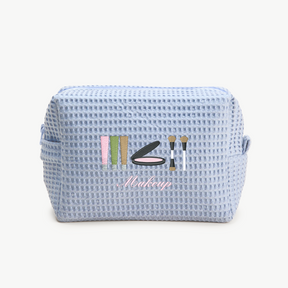 Blue textured makeup bag with 'Makeup' text and icons on a white background