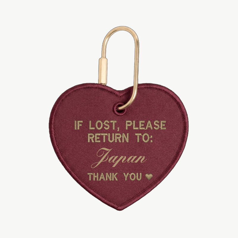 Heart-shaped keychain with text 'If lost, please return to: Japan' on a white background