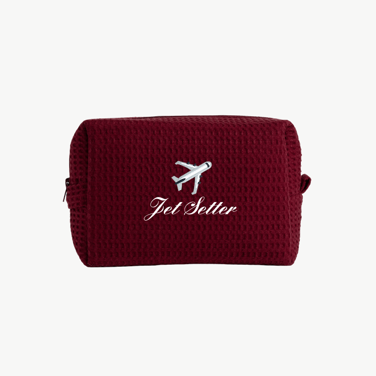 maroon waffle pouch with embroidered airplane icon and "Jet Setter" text