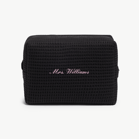 A black waffle pouch with the text 'Mrs. Williams'  on the front, displayed on a plain white background.