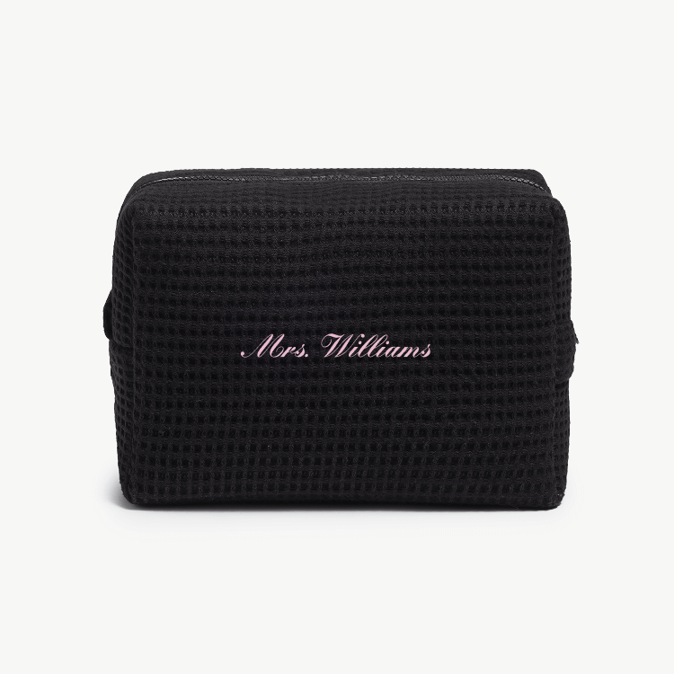 A black waffle pouch with the text 'Mrs. Williams'  on the front, displayed on a plain white background.