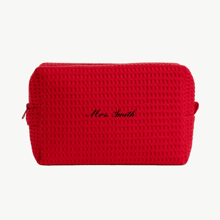 A red waffle pouch with the text 'Mrs. Smith'  on the front, displayed on a plain white background.