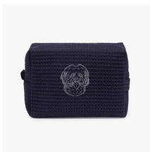 A navy blue waffle zippered pouch with a white line drawing of a dogs face on the front.