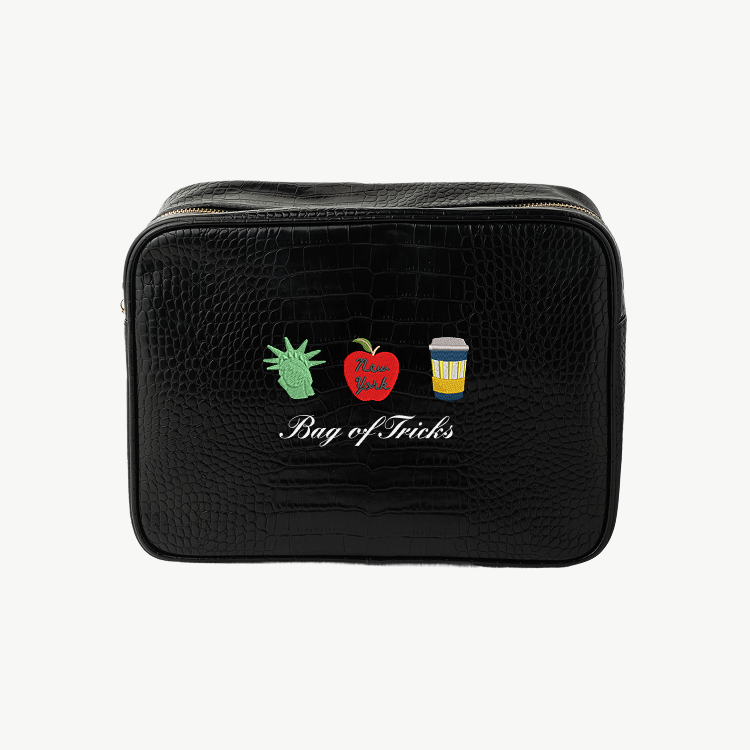 Black toiletry bag with 'Meet me in Lake Michigan' design on a white background