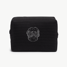 A black waffle zippered pouch with a white line drawing of a dogs face on the front.