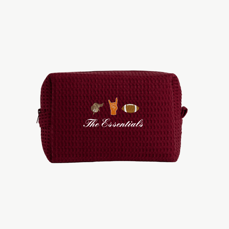maroon waffle pouch with embroidered icons and text