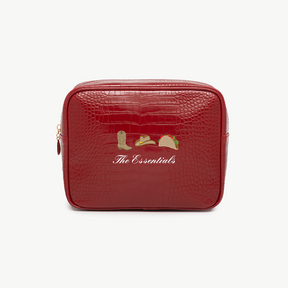 Red toiletry bag with 'The Essentials' text and icons on a white background