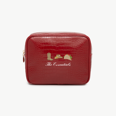 Red toiletry bag with 'The Essentials' text and icons on a white background