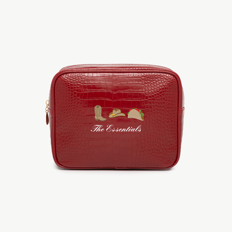 Red toiletry bag with 'The Essentials' text and icons on a white background