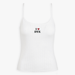 White ribbed tank top with a small embroidered design on a white background