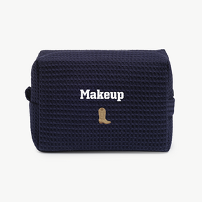 Navy blue makeup bag with 'Makeup' text and a boot design on a white background
