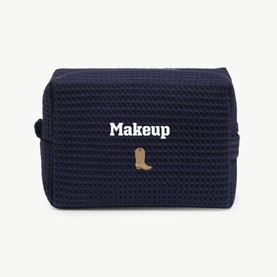 Navy blue makeup bag with 'Makeup' text and a boot design on a white background