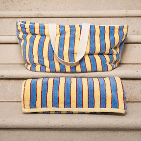 Striped bag and pouch on wooden steps