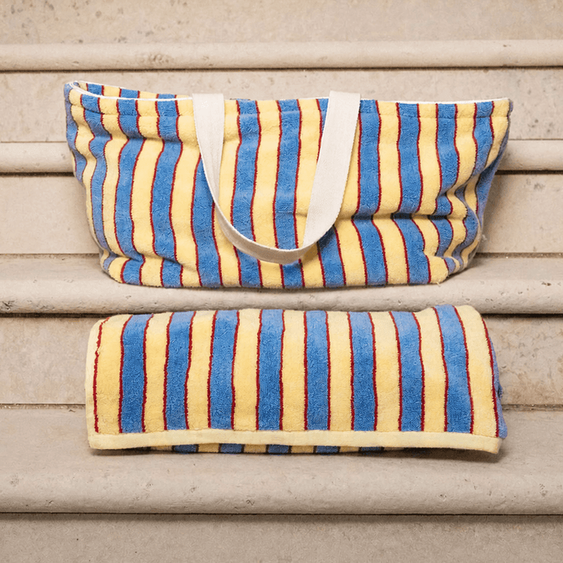 Striped bag and pouch on wooden steps