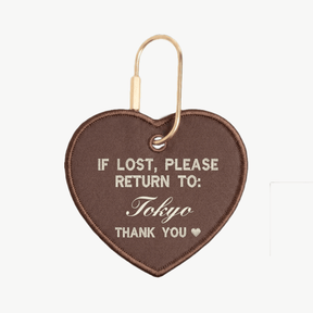 Heart-shaped keychain with text 'If lost, please return to: Tokyo' on a white background