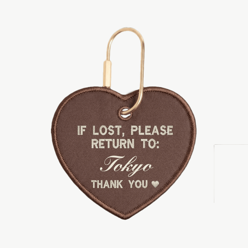 Heart-shaped keychain with text 'If lost, please return to: Tokyo' on a white background