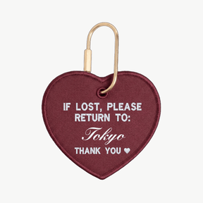 Heart-shaped keychain with 'If lost, please return to: Tokyo' text on a white background