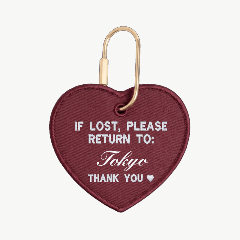Heart-shaped keychain with 'If lost, please return to: Tokyo' text on a white background