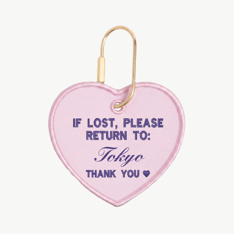 Heart-shaped keychain with text 'If lost, please return to: Tokyo' on a white background