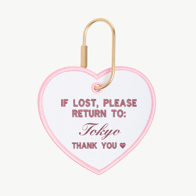 Heart-shaped keychain with text 'If lost, please return to: Tokyo' on a white background